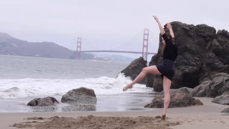 intense, dramatic interpretive dancing on the sandy beach, golden gate bridge, wide