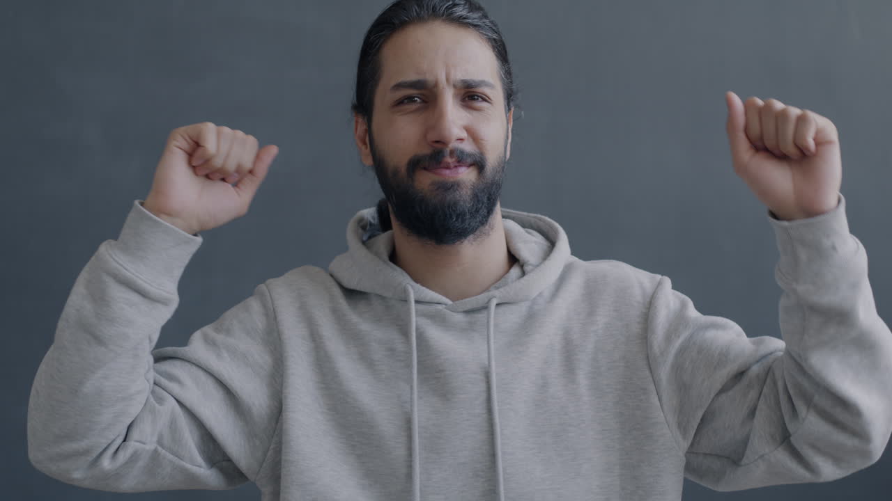 Happy Man with Raised Arms