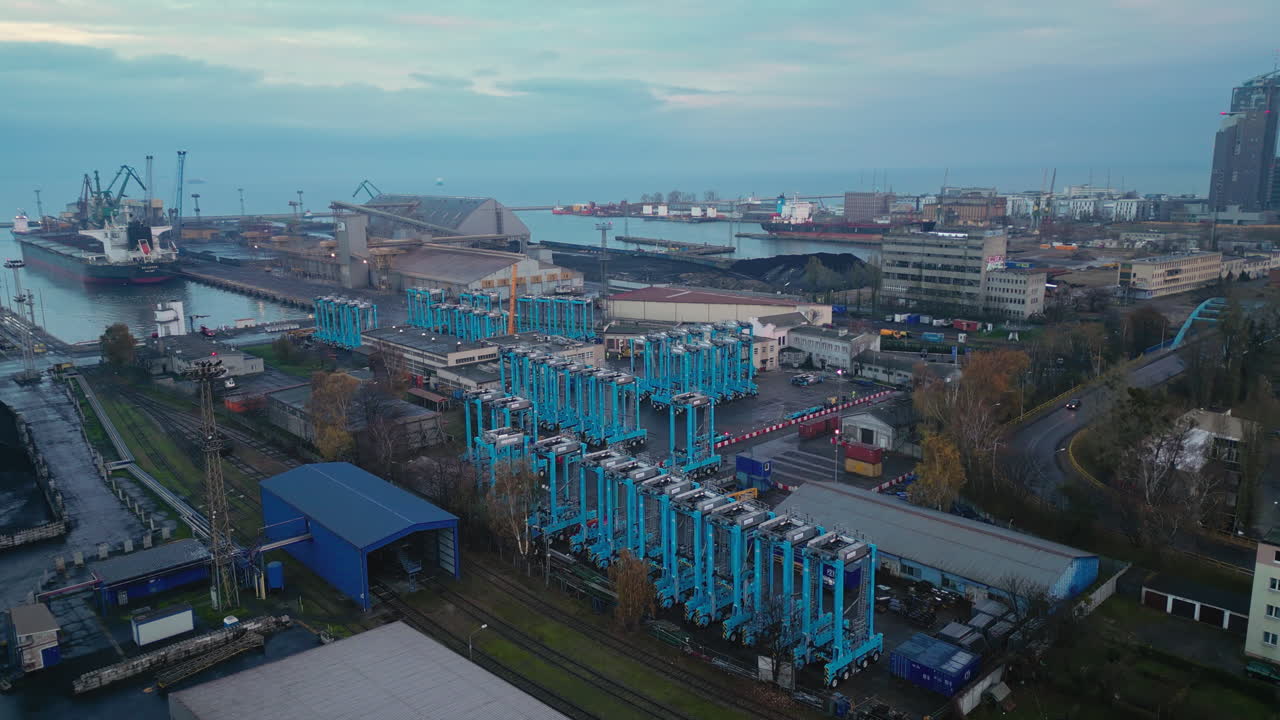 Aerial View of a Port with Cranes and Industrial Infrastructure