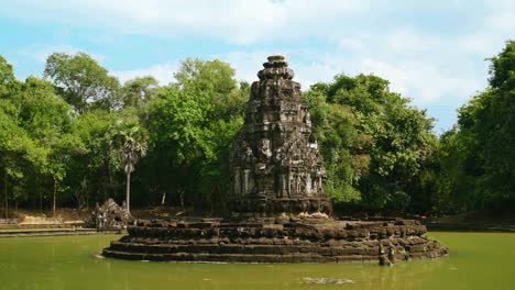 temple of neak pean or neak poan surrounded by jayatataka baray lake at angkor wat complex, siem reap, cambodia