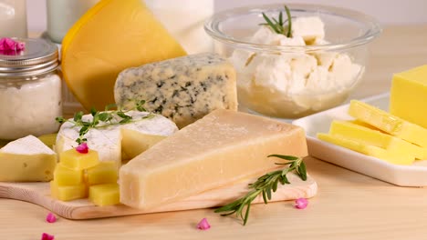 various cheeses and dairy items on a table