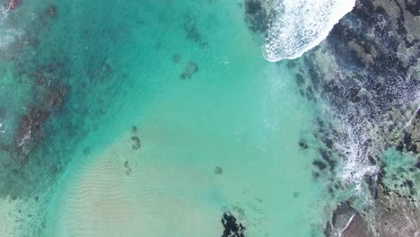 Crystal-clear-ocean-waves-crashing-near-Bali-island