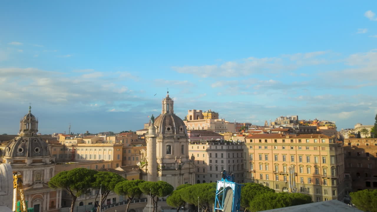 Scenic view of Roman skyline with historic domes and pastel-colored buildings under a bright morning sky.