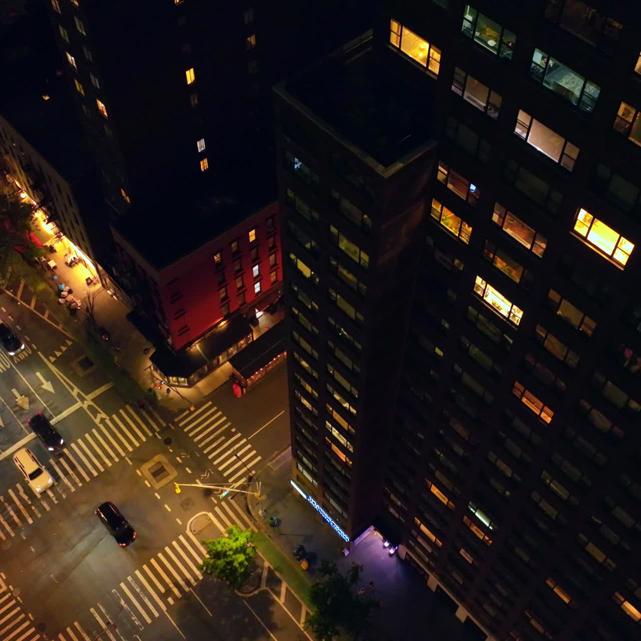 Busy New York roads at night. Lively streets of vibrant metropolis from aerial perspective