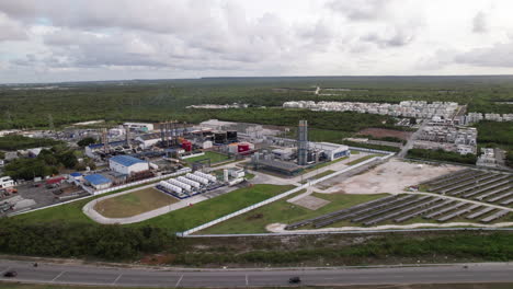 Aerial-View-Of-CEPM-Electric-Utility-Company-With-Field-Of-Photovoltaic-Solar-Panels-In-Punta-Cana