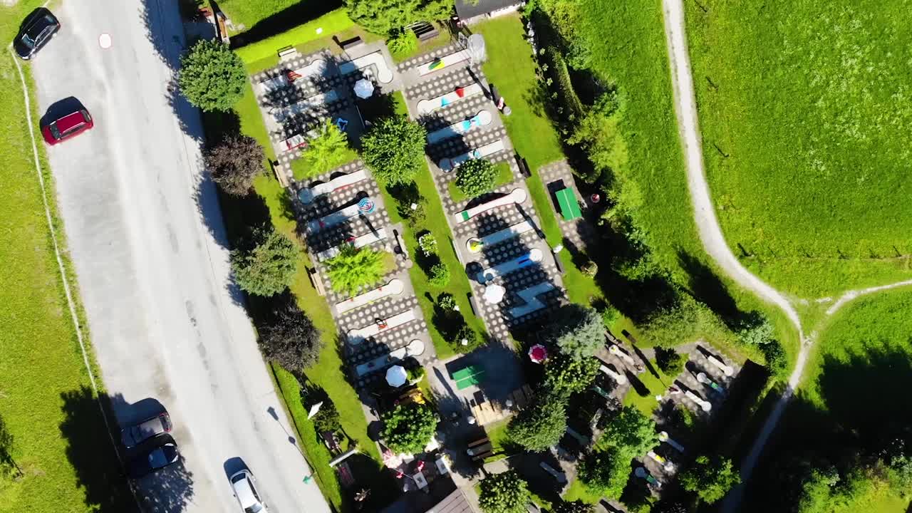 A mini golf course in Saalfelden, Austria. A local place of entertainment surrounded by beautiful mountain views and Austrian culture. Shot in native 24 fps.