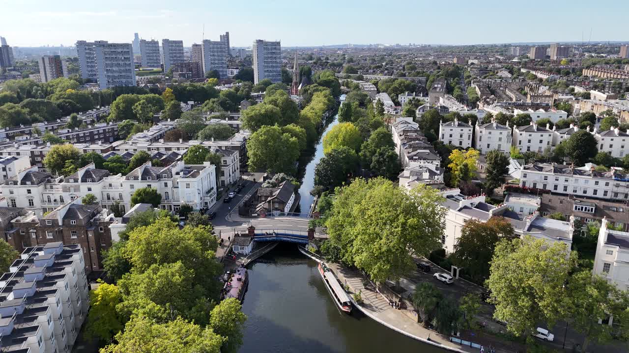 Pull back drone aerial reverse reveal Regents canal Little Venice London UK