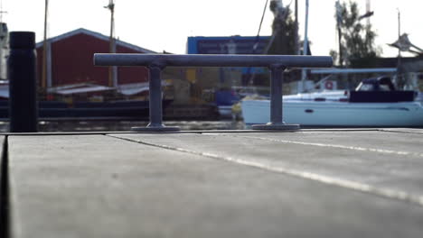 Marina-dock-view-with-blurred-boats-in-the-background