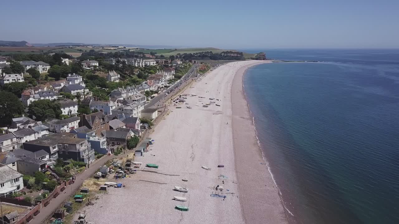 Aerial view of a seaside town with a pebble beach
