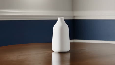 minimalist white vase on wooden table