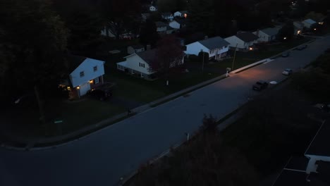 car driving in american neighborhood at night