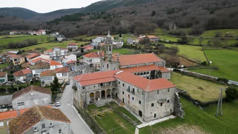 drone orbits around santa maria de xunqueira monastery and vaulted hallways