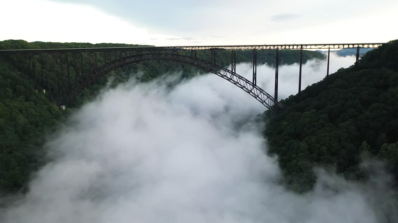 New River Gorge Bridge and Fog Above Canyon and Under Arch, Drone Aerial View, West Virginia, USA