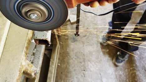 cutting the iron bar and sparks