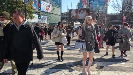 crowded intersection with people crossing