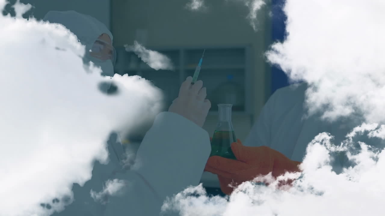 Female scientist injecting into syringe in health lab while partner holding green flask with clouds