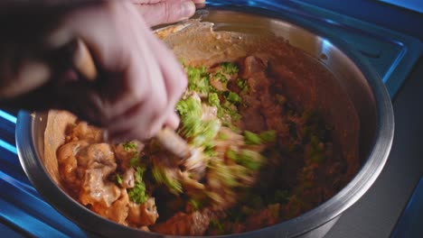 mixing chicken breast and chopped broccoli with low fat cheese and olive oil