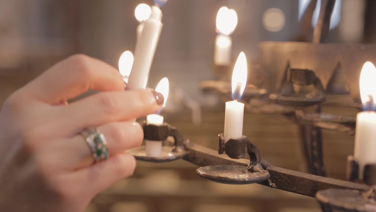 Person's Hand Lighting Candle On Votive Candle Holder - Prayer Candle