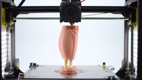 a close-up view of a 3d printer fabricating a detailed prosthetic limb, highlighting the complex manufacturing process and innovative technology in action