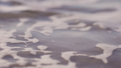 sea waves rushing at the beach during sunset