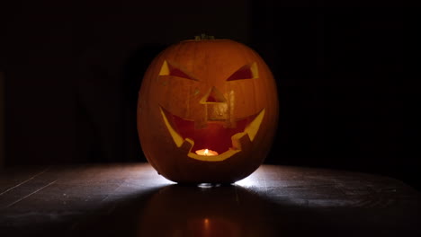 hallowing evil spooky pumpkin jack 'o lantern glowing in the dark