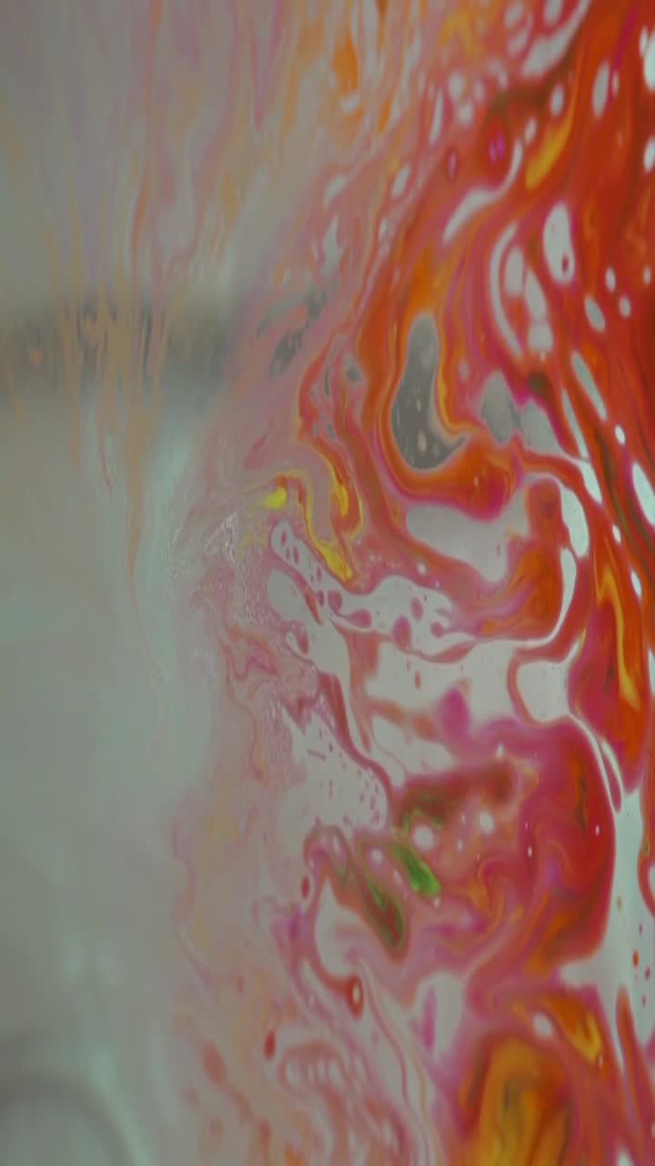 Vibrant Abstract Paint Swirling and Mixing in Fluid Motion