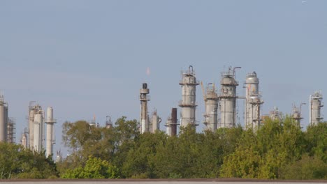 establishing shot of chemical refinery plant in pasadena, texas community