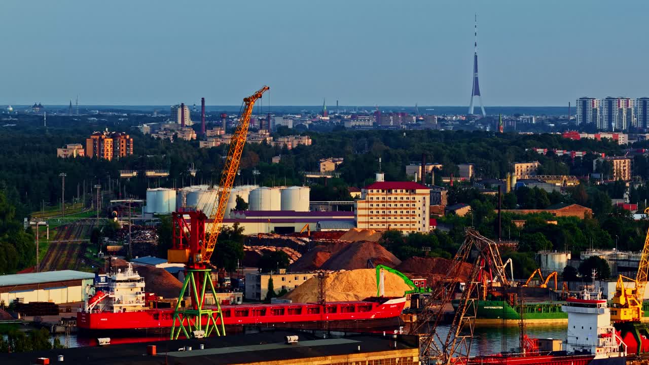 Late summer evening sunlight falling over the industrial harbor. Aerial drone shot