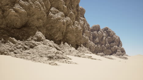 desert landscape with sand dunes and rock formations