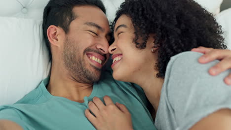 interracial couple taking selfie with phone