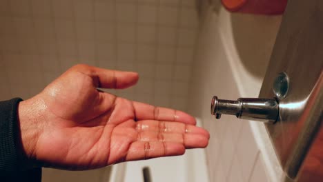 hand washing in a public restroom