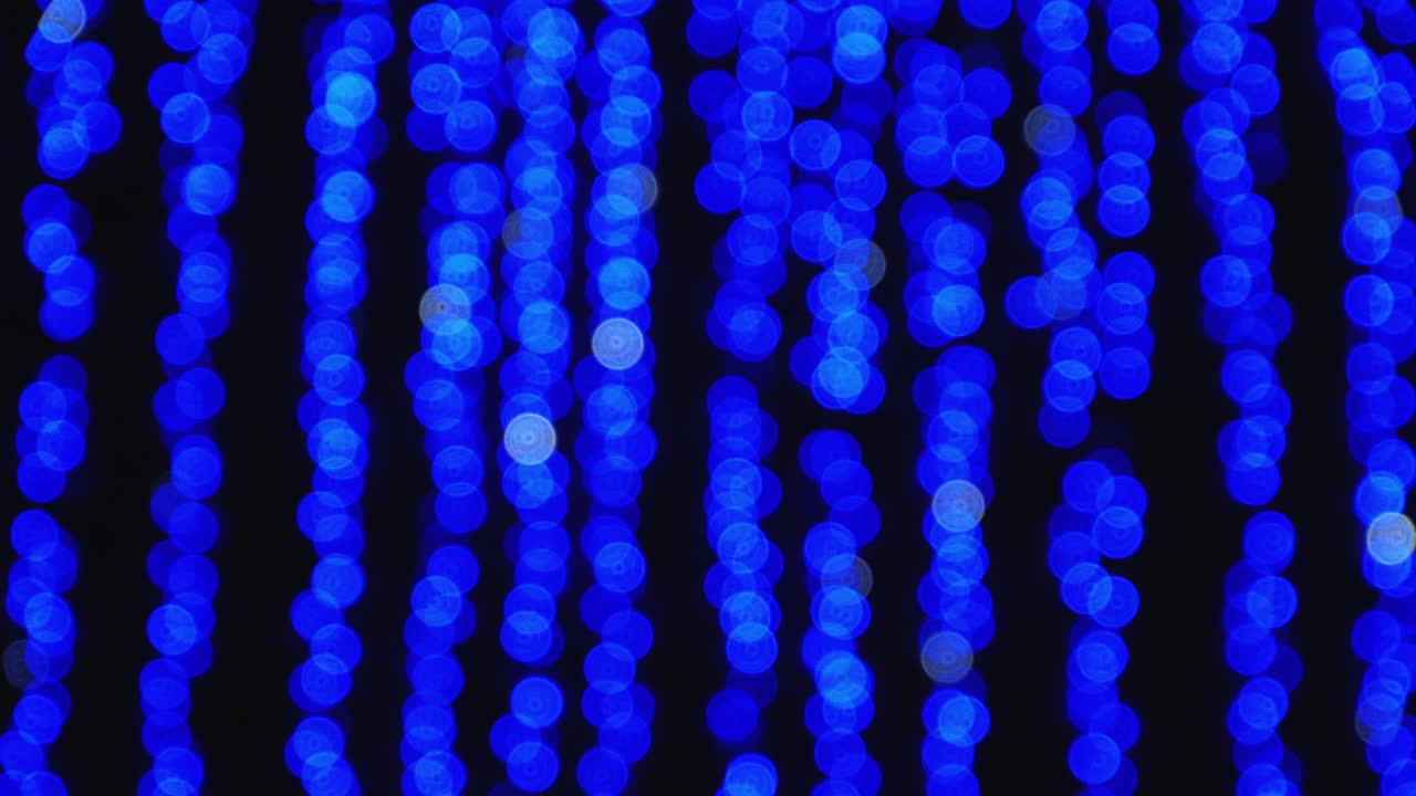Blue and white bokeh mugs shimmering in the dark