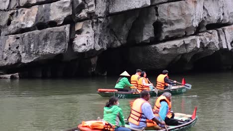 tourists enjoy a boat ride in ninh binh