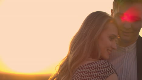 Two-lovers-dance-together-on-the-roof-at-sunset-in-the-sunlight.-Romantic-dancing