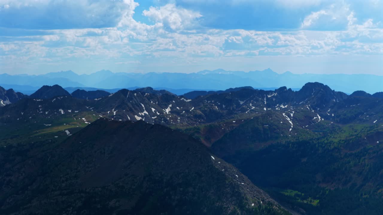 Elk Mountains range Colorado aerial drone spring summer Maroon Bells Capitol Peak Mount Snowmass Castle Conundrum Peak Rocky Mountains Sawatch Range Mount of the Holy Cross 14er circle right motion