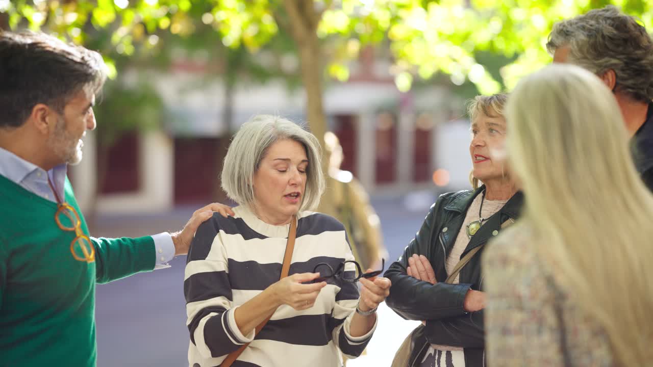 Group of people talking on the street