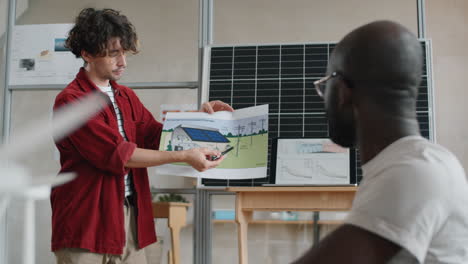 engineer presenting renewable energy home project to coworkers