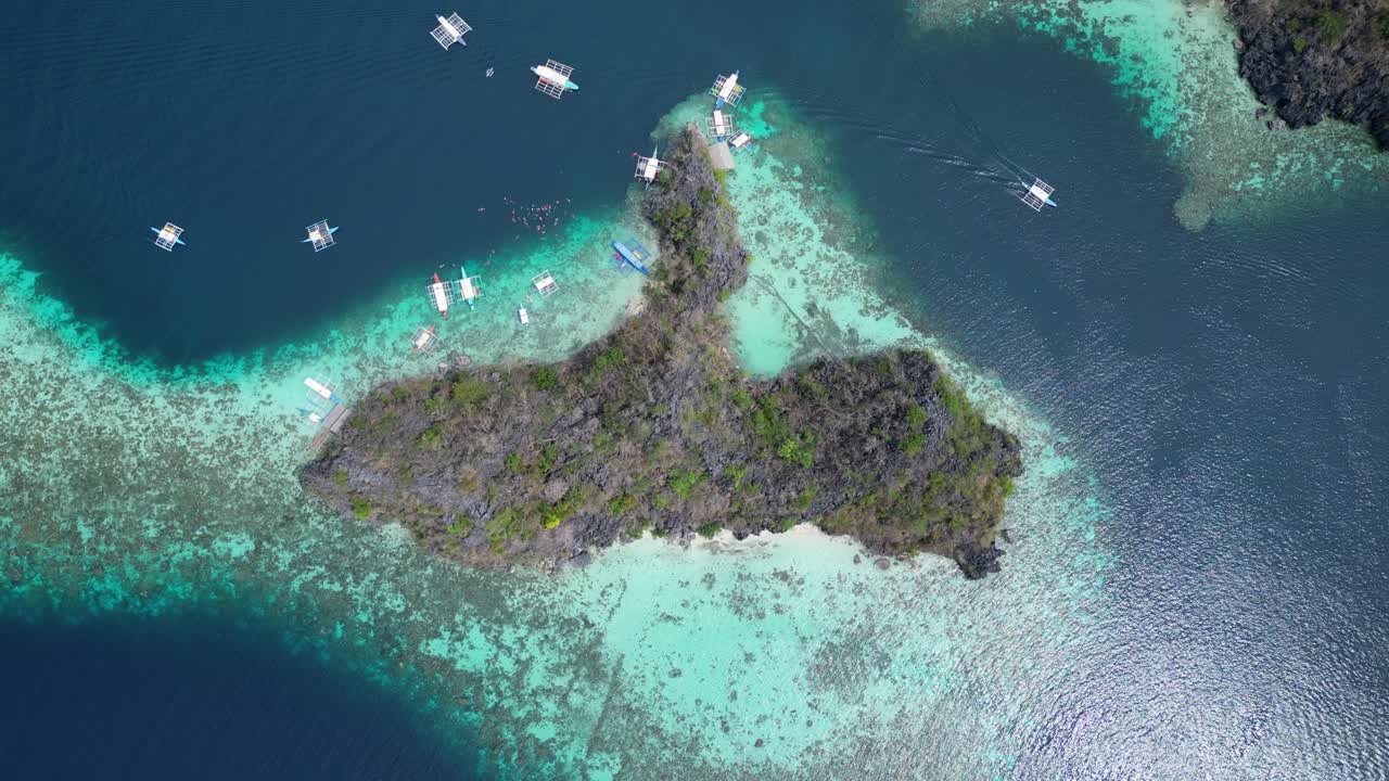Snorkeling Tour Boats at Reef of Tropical Malwawey Island in Coron, Drone Overhead