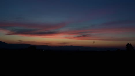 sunset progressing creating silhouettes and a bat flying to the left, khao yai, nakhon ratchasima, thailand