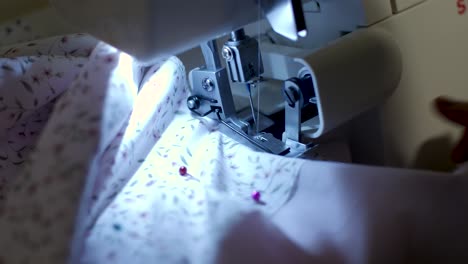 close up footage of sewing machine at night time