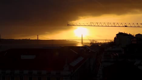 sunset over the tagus river in lisbon, portugal