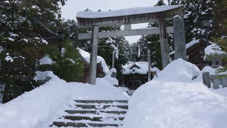 japanese torii, covered in snow after blizzard