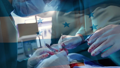 animation of waving honduras flag against team of diverse surgeons performing operation at hospital