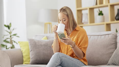 Coffee,-phone-and-woman-relax-on-a-sofa