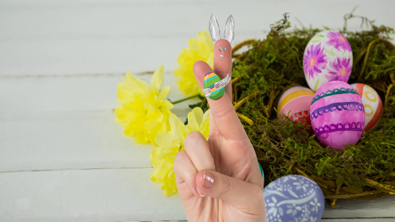 Animation of hands with drawings of rabbit with easter egg over easter eggs in nest