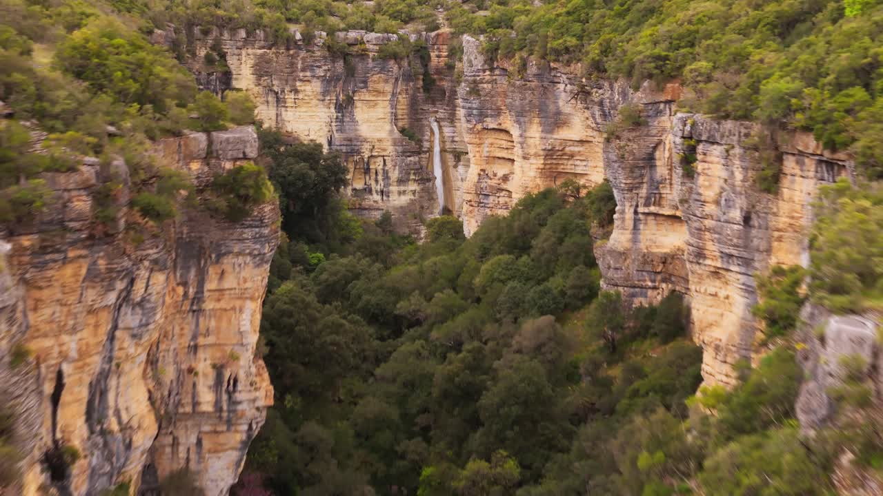 Serene Osum Canyon in Albania with lush cliffs and vibrant nature