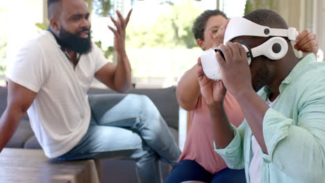using vr headset, diverse friends enjoying virtual reality experience together at home