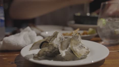 oysters at seafood restaurant, focus pull shot