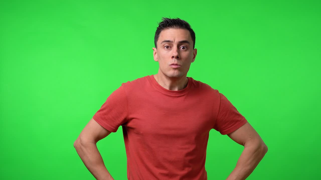 Aggressive man in a red shirt. Medium shot.