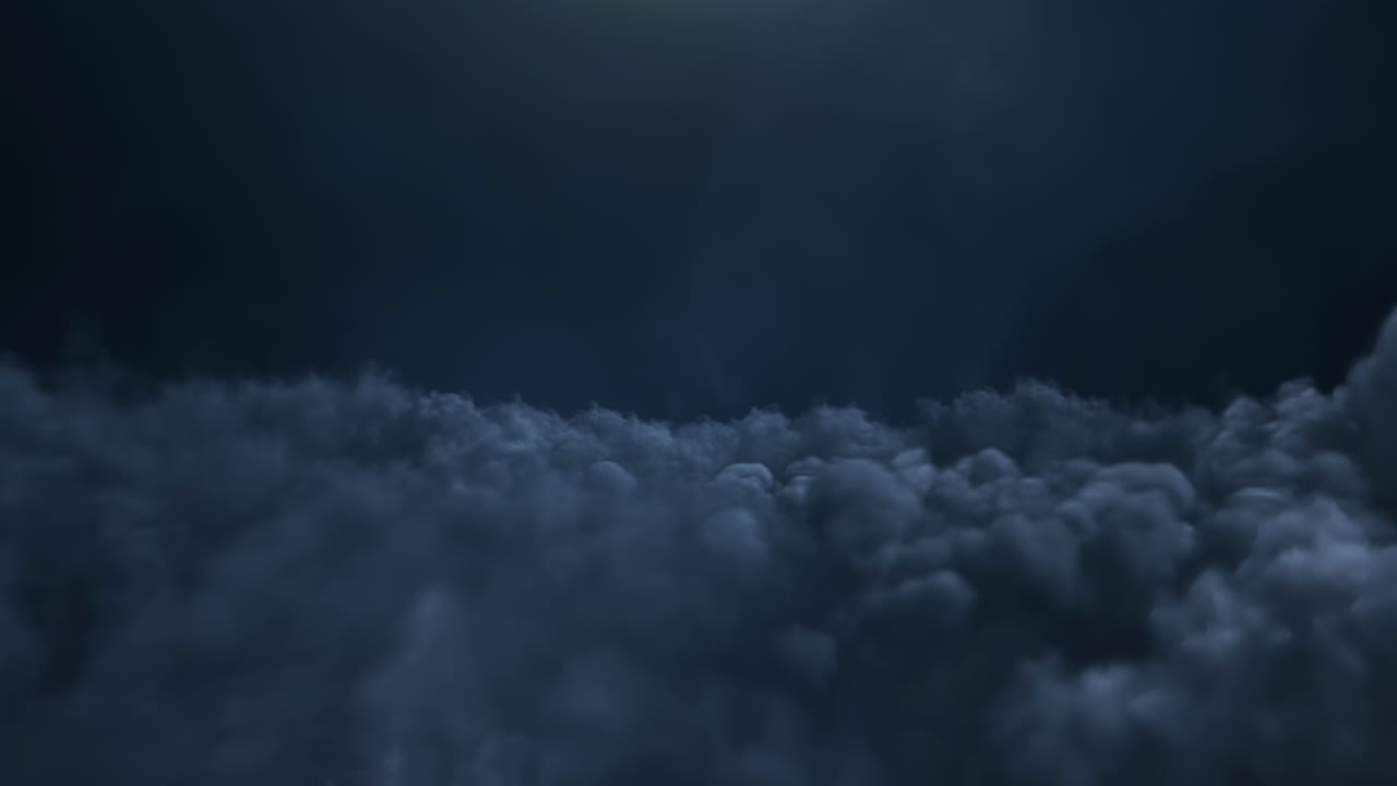 Enigmatic and mysterious dark clouds resting over an illuminated sky above us all